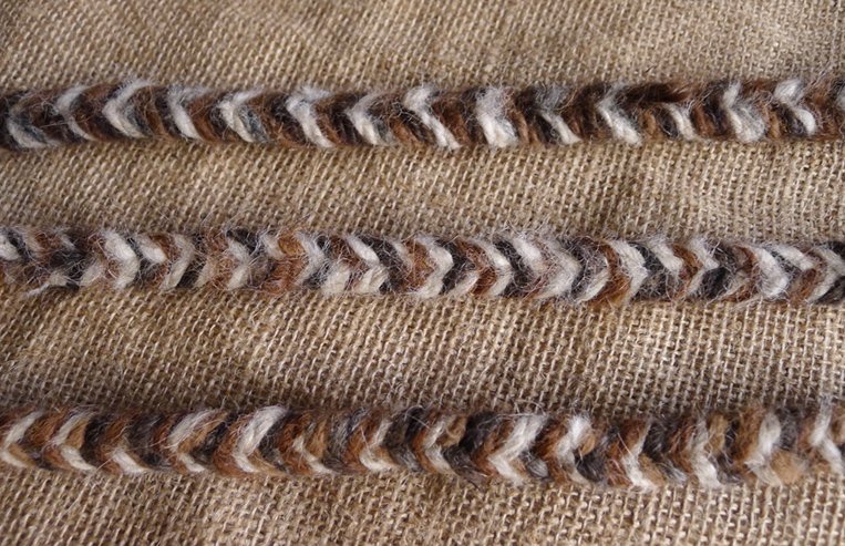 Rope made from llama fibre is twisted together.