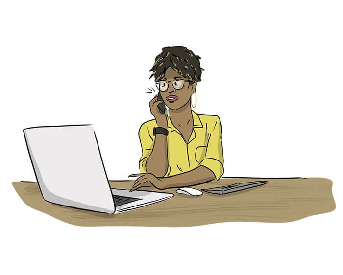 An illustrated woman wearing a suit stands next to a computer while talking on her phone. 