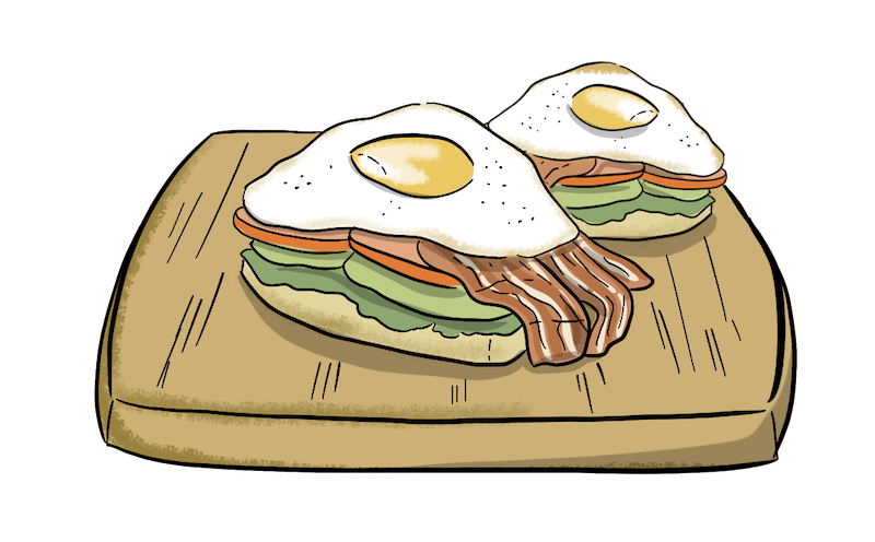 Two egg sandwiches on a platter are shown. 