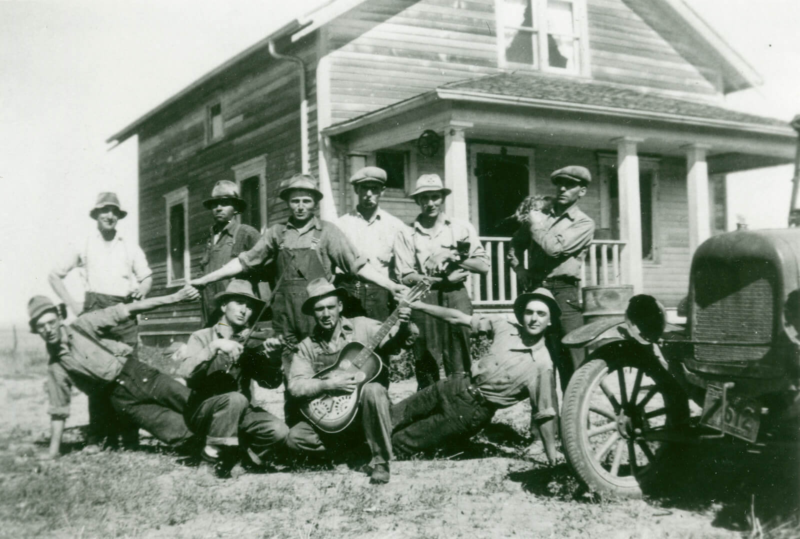 A piece of art by Leah Marie Dorion made with mosaics shows two Indigenous people standing near animals, sun, and water. 